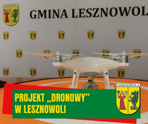 Białe urzdzenie ze śmigłami na pomarańczowym polu, w tle herby gminy Lesznowola i napis Gmina Lesznowola