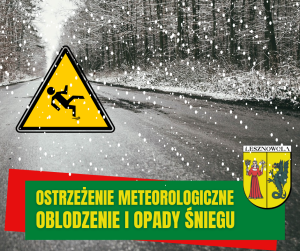 Droga asfaltowa w lesie, na zdjęciu znaczek w żółtym trójkącie figura przewracającego się człowieka. Na dole na zielonym pasku napis: OSTRZEŻENIE METEROLOGICZNE OBLODZENIE I OPADY ŚNIEGU. Na dole po prawej herb gminy Lesznowola.