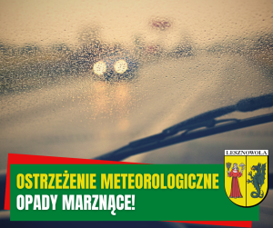 Widok ulicy z za szyby samochodu.