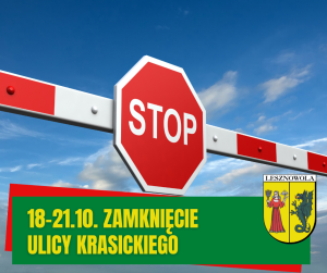 Zdjęcie ze szlabanem i znakiem stop na tle nieba