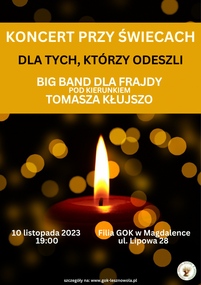 Paląca się świeca na ciemnym tle.