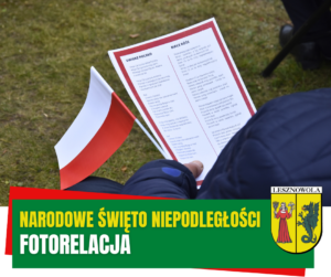 chorągiewka biała-czerwona, kartka z pieśniami patriotycznymi. Na zielonym pasku napis Narodowe Święto Niepodległości